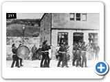 Fortrose - Fife and Drum band, as part of the opening of the Railway and Station Road, passing Macleod's Bakery, High Street
